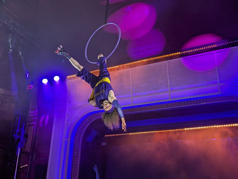 aerialist on a hoop, in roller skates, high in the air