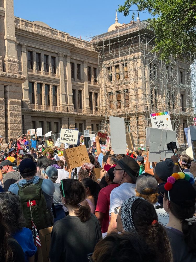 view of crowd in front of the capitol building from inside the crowd