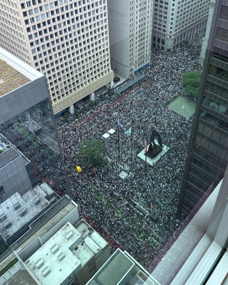 aerial shot of an enormous public square jam packed with people, this was the rally but there were 10 full city blocks of people marching behind this