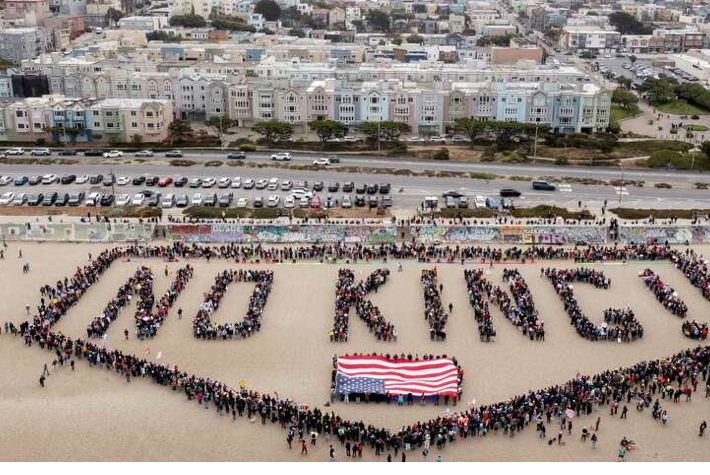 aerial photo of no kings spelled out with the letters formed by the bodies of a huge crowd of people